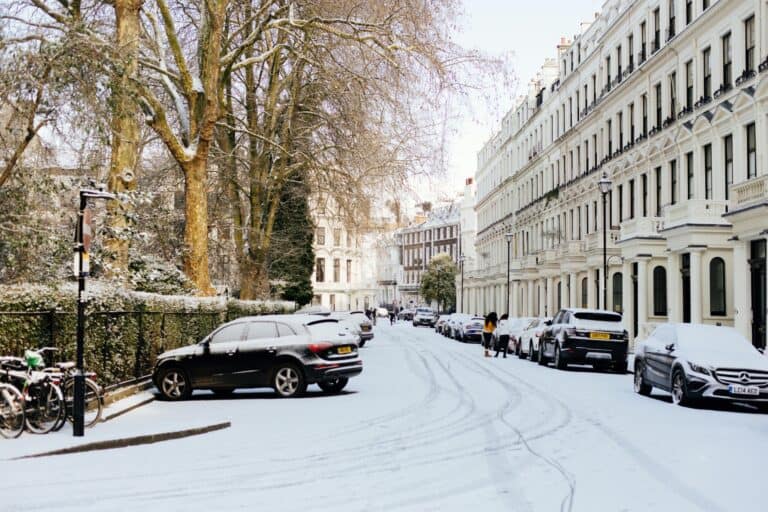 A line of terraced houses covered in snow in the concept of relocating to Harrow.