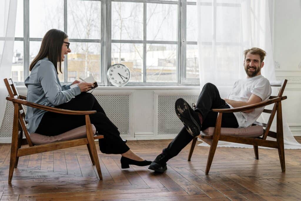 A man sitting in front of a counsellor