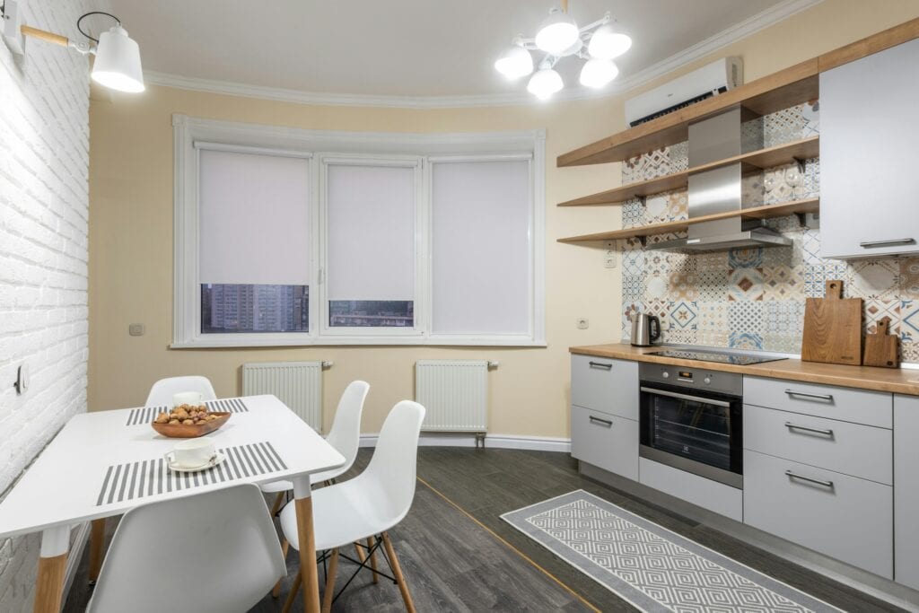 A kitchen and dining room in a small flat
