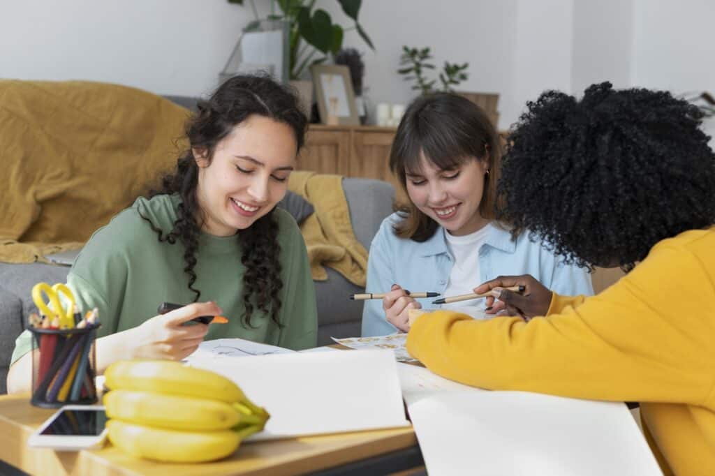 College students working on a project in their shared flat