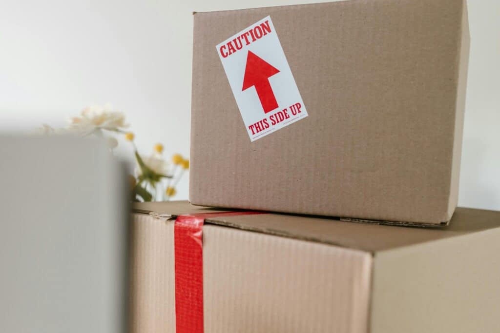 Stack of moving boxes with special instruction